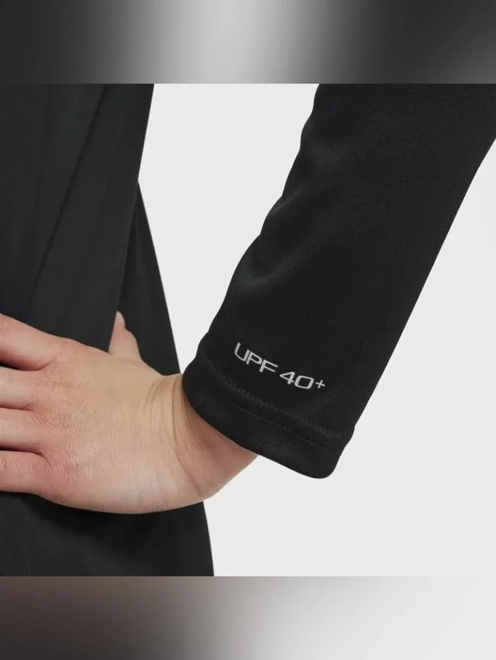 Nike Swim Dri-FIT long-sleeve Rashguard features a classic athletic crewneck